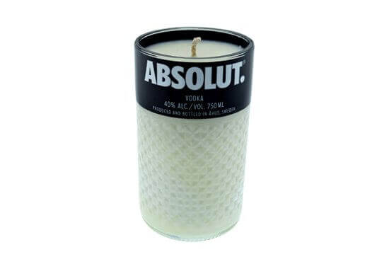 The Recycled Vodka Candle – Absolut is a hand-poured, all-natural soy candle in a glass made from an upcycled Absolut Vodka bottle, featuring the original iconic label at the top.