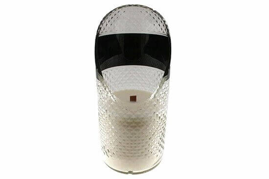 Clear plastic automatic air freshener dispenser with textured surface, shown upright with visible spray opening and interior—perfect to pair with a Recycled Vodka Candle – Absolut for a refreshing atmosphere.