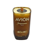 The Recycled Avion Liqueur Candle, made from a brown glass Avión Espresso Liqueur bottle with a wooden cap, is hand poured with soy wax and displayed against a white background.