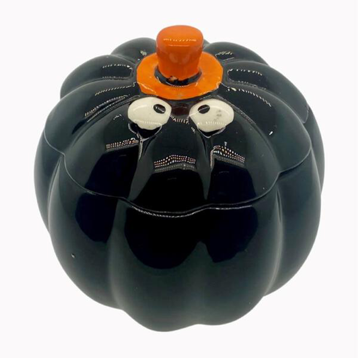 The Ceramic Black Halloween Pumpkin Candle w/ Hat Lid is a pumpkin-shaped black ceramic container with white eyes and an orange stem lid—ideal as a Halloween candle holder or for showcasing your favorite soy wax candle.