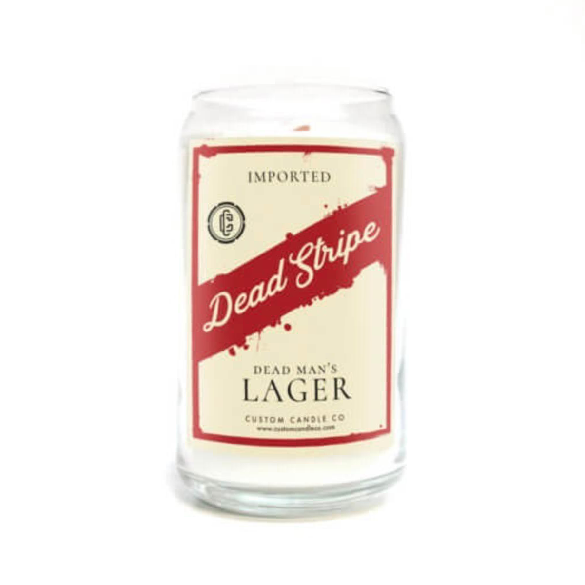 The Dead Strip Dead Man’s Lager Beer Can Candle by Custom Candle Co. is a glass candle holder styled as a beer can—a perfect spooky decor accent or Halloween candle for your home.
