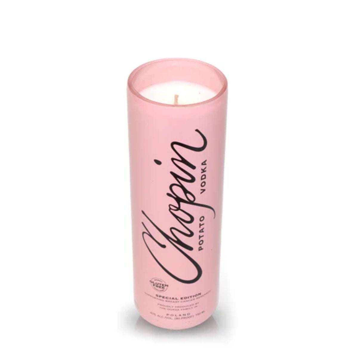 A pink cylindrical Recycled Chopin Potato Vodka Candle with black printed text stands upright on a white background.