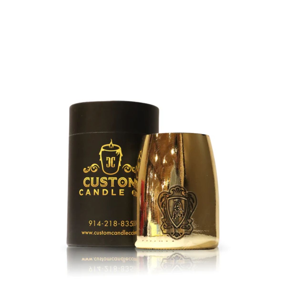 The Recycled Lamborghini Champagne Candle, made from repurposed bottles and set in a gold reflective glass holder, is shown in front of its black and gold Custom Candle Co. packaging.