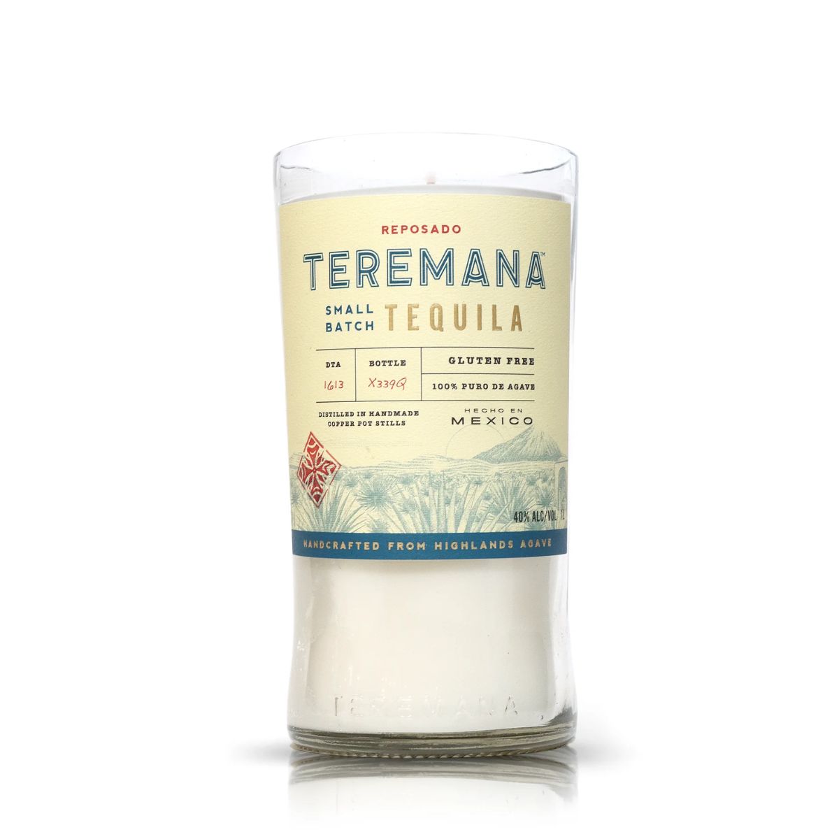 The Recycled Teremana Tequila Candle is a clear glass holder made from a repurposed tequila bottle, featuring the original blue and gold label—an ideal pick for fans of unique, eco-friendly tequila bottle candles.