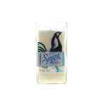 The Recycled Sauza Silver Tequila Candle is a white soy candle in a clear glass holder with a blue rooster and "Sauza Tequila Silver" label—perfect for tequila lovers.