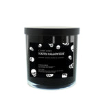 The Musical Halloween Candle – Candy Corn Black is a soy candle in a black jar with a black lid, featuring a label with white skulls and "Candy Corn Happy Halloween Custom Candle Co." text, set against a white background.