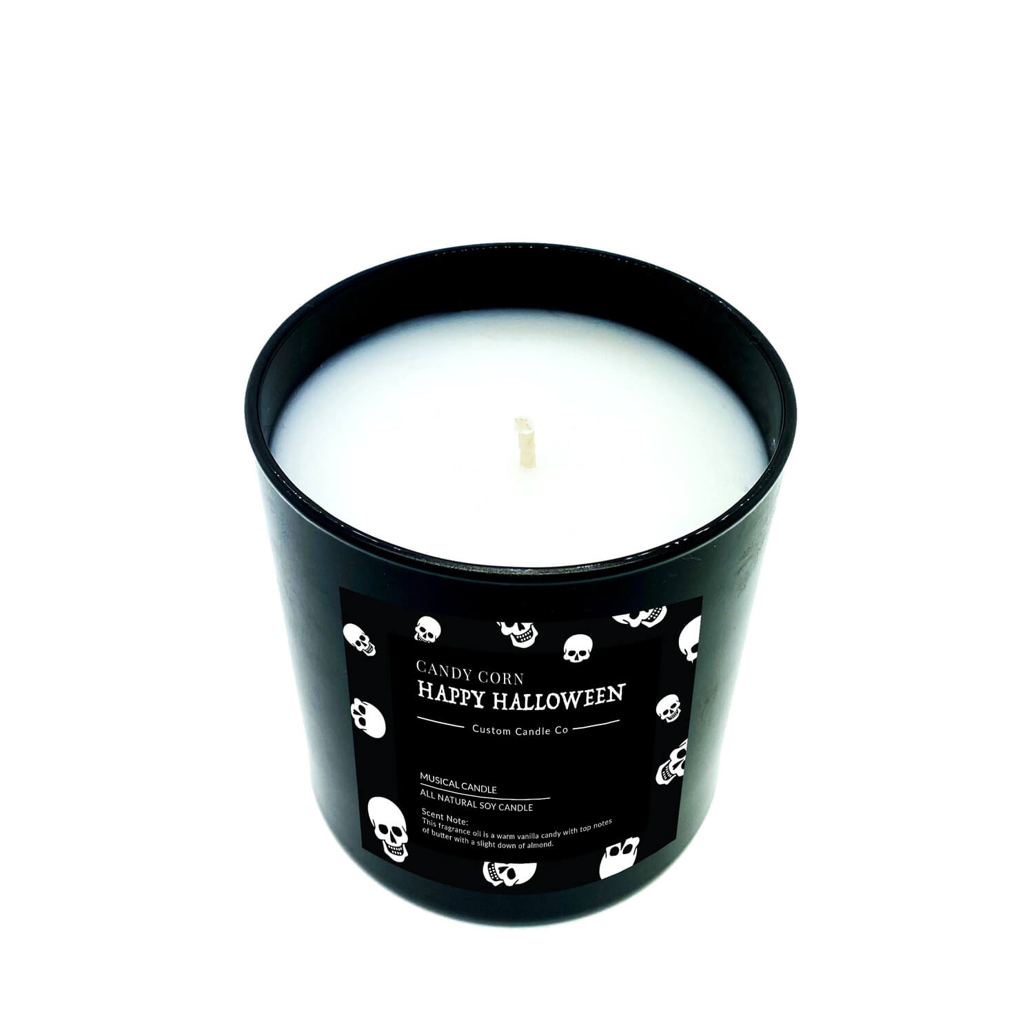 The Musical Halloween Candle – Candy Corn Black features a black container, white wax, and a Halloween-themed label with skulls, ghosts, and "Candy Corn Happy Halloween"—a festive scented candle for your spooky décor.