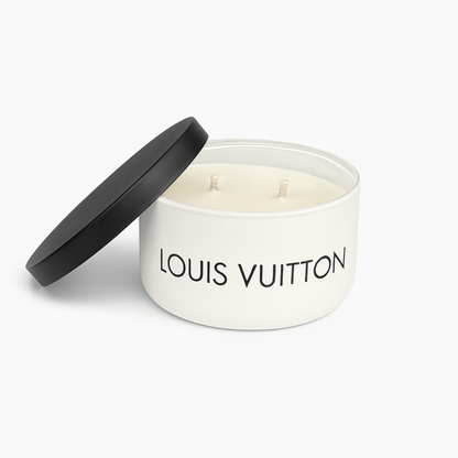 The Luxury White Two-Wick Candle – Inspired by Iconic Designer Style is presented in a round container with a black lid placed beside it.