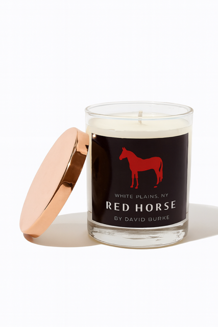 The Custom Red Horse Candle features a rose gold lid and a black label with a red horse silhouette and the text "Red Horse by David Burke, White Plains, NY.