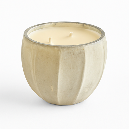 The Frosted Pearl Candle features off-white soy wax with two wicks in a beige, round, ridged container, presented against a plain white background.