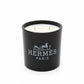 The Designer Paris Candle is a black luxury scented candle with two wicks and the brand logo on the front.