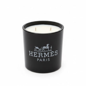 The Designer Paris Candle is a black luxury scented candle with two wicks and the brand logo on the front.