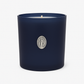 The Boxed Blessed Mother Candle is hand-poured with coconut-apricot wax in a navy matte glass, featuring a silver religious medallion, for a serene and scented experience.