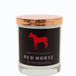 The Custom Red Horse Candle features all-natural soy wax in a glass jar with a copper lid and black label showing a red horse silhouette and "White Plains, NY Red Horse by David Burke," adding elegance to any space.