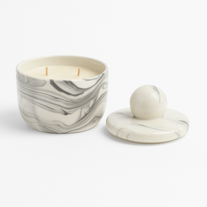 The Double Wick Marble Luxe Candle is a natural soy candle in a reusable marble-patterned jar with a matching lid, shown on a white background.