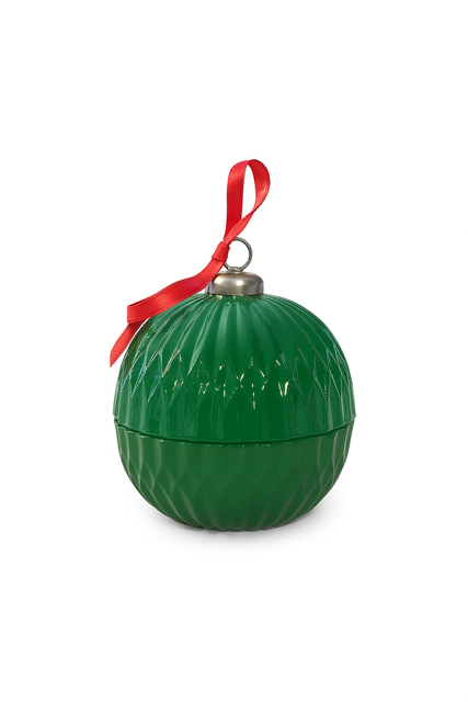 The Christmas Ornament Candle features a green, textured surface with a silver cap and red ribbon loop. Crafted from coconut apricot wax, it is displayed against a white background.