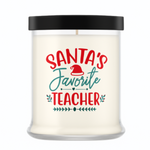 The Santa's Favorite Teacher Candle with Matches features natural white wax in a clear glass jar with a black lid. The label reads "Santa's Favorite Teacher" in red and green with a Santa hat—an ideal holiday teacher gift.