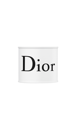 A white cylindrical container labeled "Dior" is centered on a plain white background, resembling the Designer White Paint Can Candle.