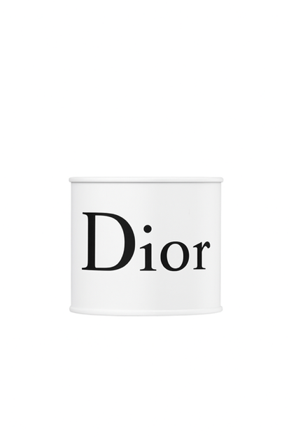 A white cylindrical container labeled "Dior" is centered on a plain white background, resembling the Designer White Paint Can Candle.