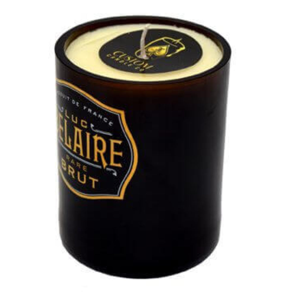 The Recycled Champagne Candle – Luc Belaire Rare Brut features a black glass jar with white wax, a label reading "LUC BELAIRE RARE BRUT," and a gold seal on the lid.