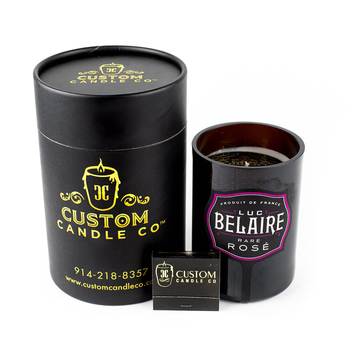 The Recycled Champagne Candle – Luc Belaire Rare Rose, in a black custom container with a branded matchbox, is hand-poured from a recycled champagne bottle and displayed against a white background.