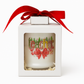 The Teacher's Christmas Candle with Matches is labeled "teacher," made from all-natural wax, features holiday decorations, and comes in a white box with a clear window topped with a red ribbon.