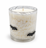 Halloween artisan candle with black glass bats on a clear speckled vessel