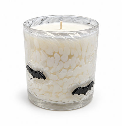 Halloween artisan candle with black glass bats on a clear speckled vessel
