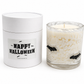 Bat Halloween candle beside its Happy Halloween gift tube