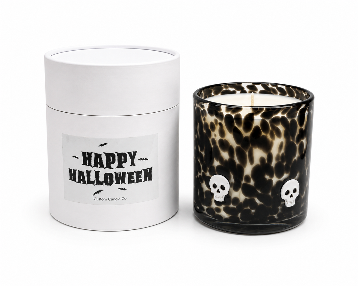 Skull Halloween candle beside its Happy Halloween gift tube