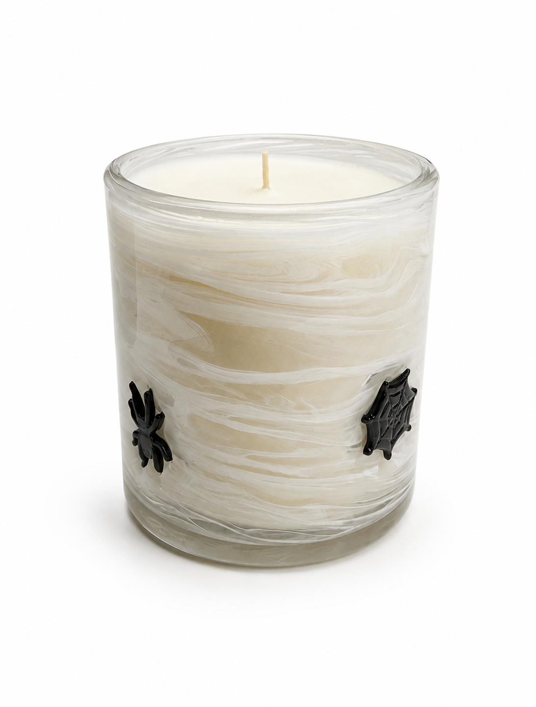 Halloween artisan candle with a black glass spider and web on a marbled vessel