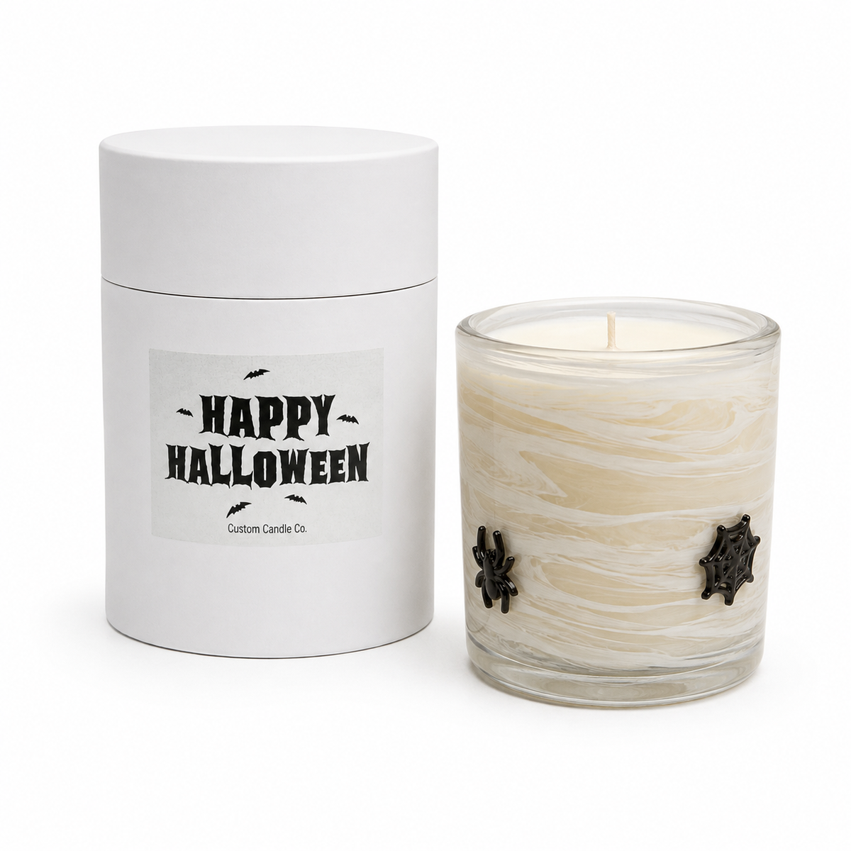 Spiderweb Halloween candle beside its Happy Halloween gift tube