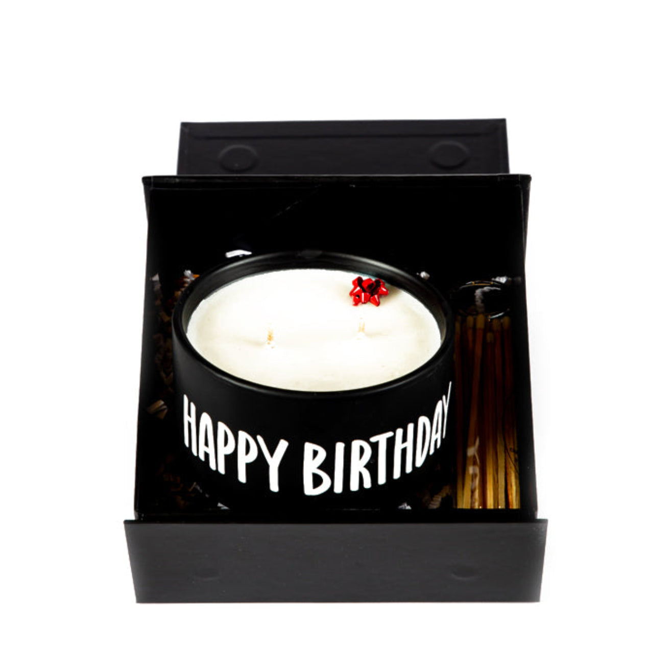 The "Happy Birthday" Candle Gift Box Set includes a white natural wax candle in a black mug labeled "HAPPY BIRTHDAY," topped with a small red bow.