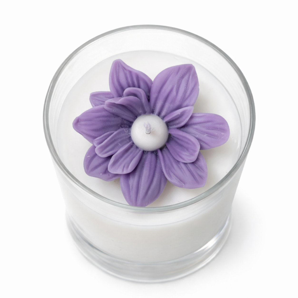 Candle with a purple flower-shaped candle top on a white background