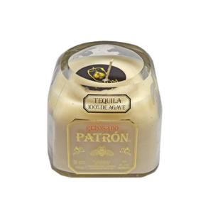 The Recycled Patron Reposado Tequila Candle is a beige soy candle in a repurposed Patron bottle, labeled "Reposado Patron" and "Tequila 100% de Agave"—a perfect recycled gift for tequila lovers.