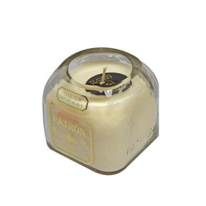 The Recycled Patron Reposado Tequila Candle is set in a repurposed clear glass Patrón bottle, adding unique charm and style to any space.