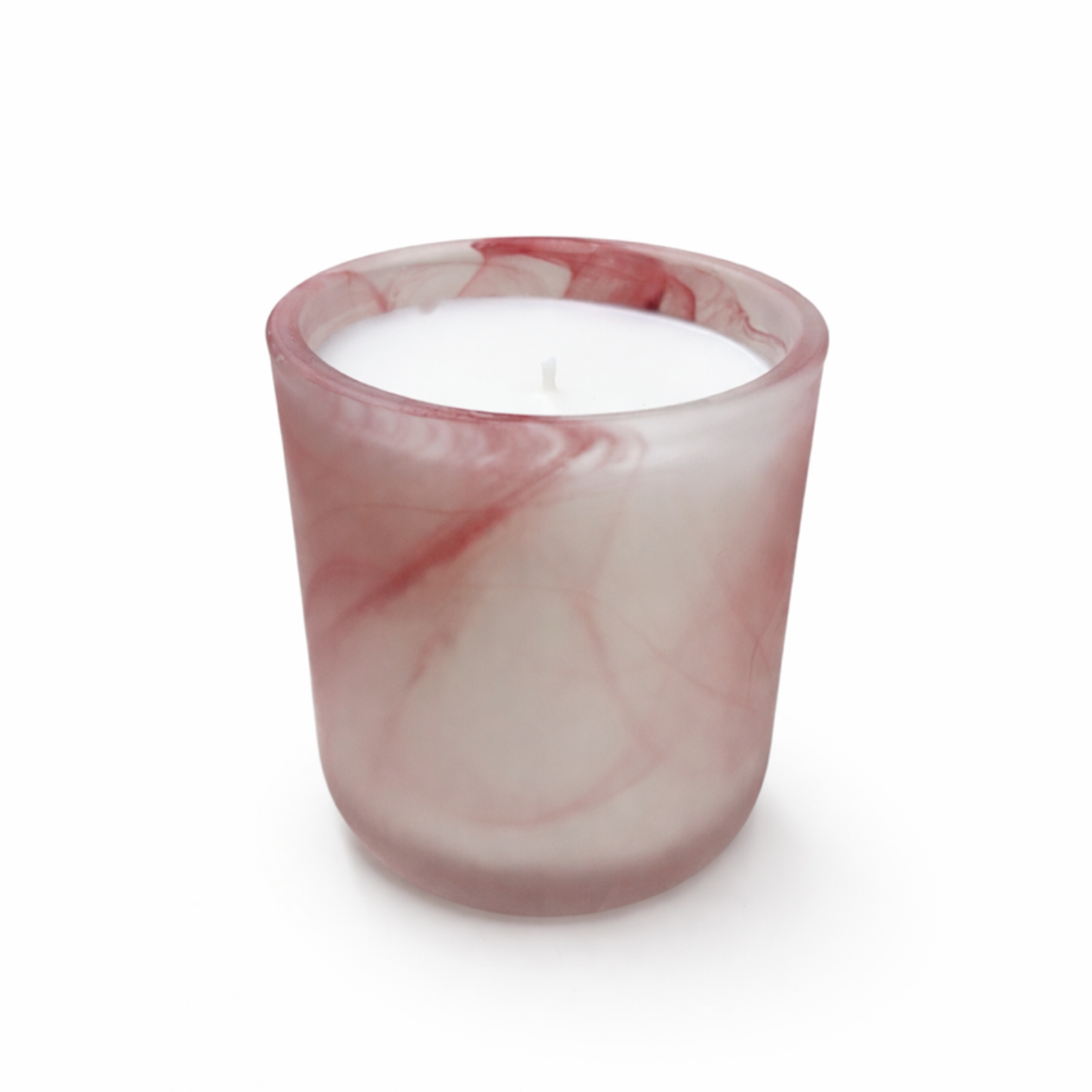 The Frosted Pink Sonoma Candle, featuring a rose scent and coconut-apricot wax, is housed in a pink and white marbled hand-blown glass holder on a plain white background.