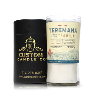 A Recycled Teremana Tequila Candle sits next to a black Custom Candle Co. container featuring contact details.