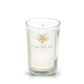 A clear glass Recycled Blanco Tequila Candle with a white wax fill features a gold logo and "Casa Del Sol Blanco" text, along with detailed product info printed on the front.