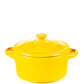 The Yellow Mini Cereal Crockpot Candle is a fruity scented soy candle in a yellow ceramic dutch oven with handles and lid, ideal for a charming mini cereal crockpot candle experience.
