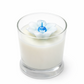 White candle with a white flower on a white background