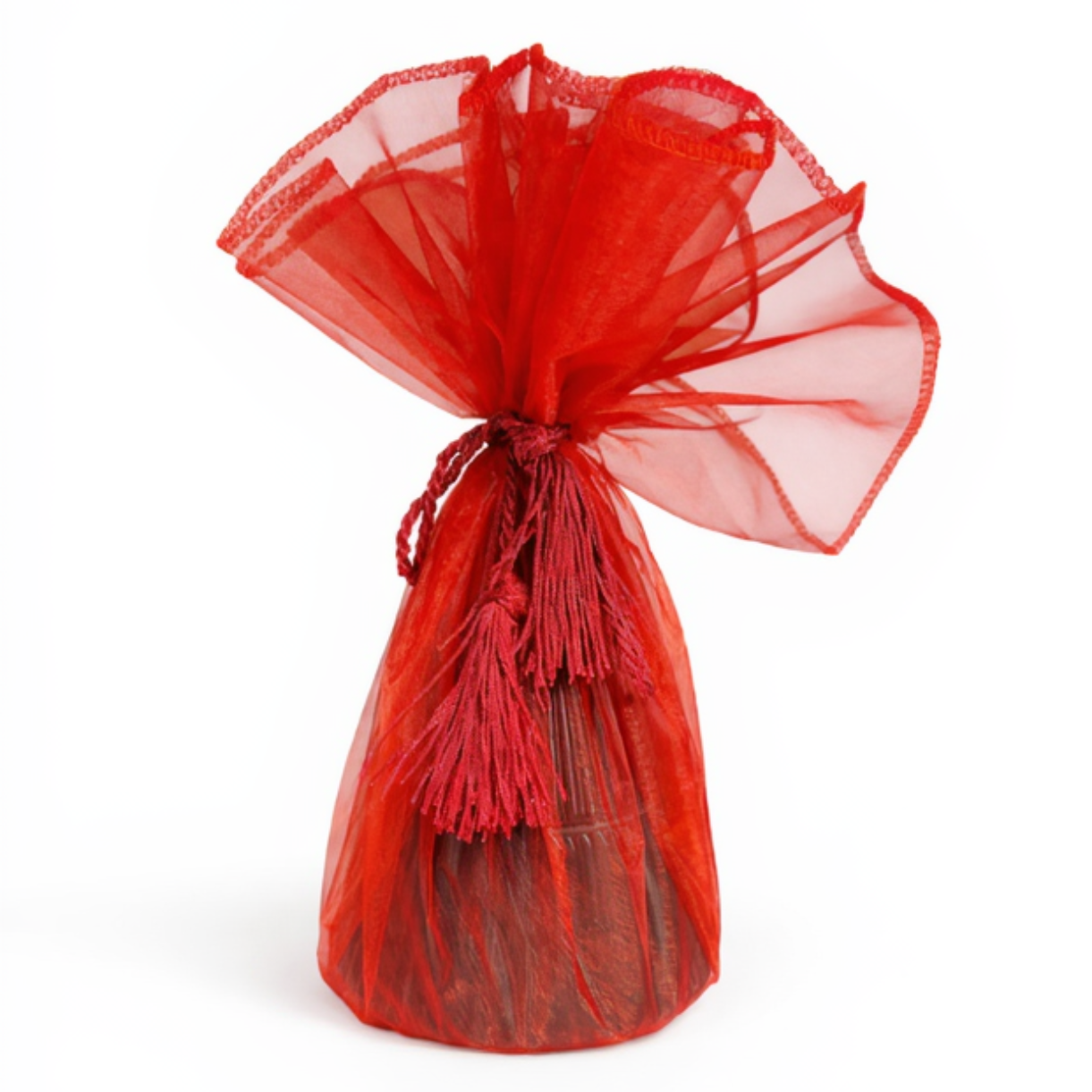 The Green Ceramic Christmas Tree Candle, a decorative keepsake, is wrapped in a sheer red organza bag with a matching string and displayed against a plain white background.