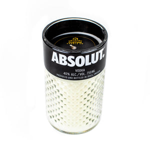 The Recycled Vodka Candle – Absolut is a hand-poured white candle in a glass container made to look like an Absolut Vodka bottle, complete with authentic brand labels and alcohol content details.