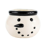 The Black Ceramic Snowman Holiday Candle features a round mug shaped like a snowman's face with black eyes, dotted mouth, and black rim—perfect for bringing festive charm to your Christmas décor.
