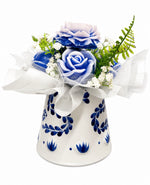 Blue Elegance Wax Melt Bouquet — blue and white rose-shaped wax melts in a painted ceramic vase