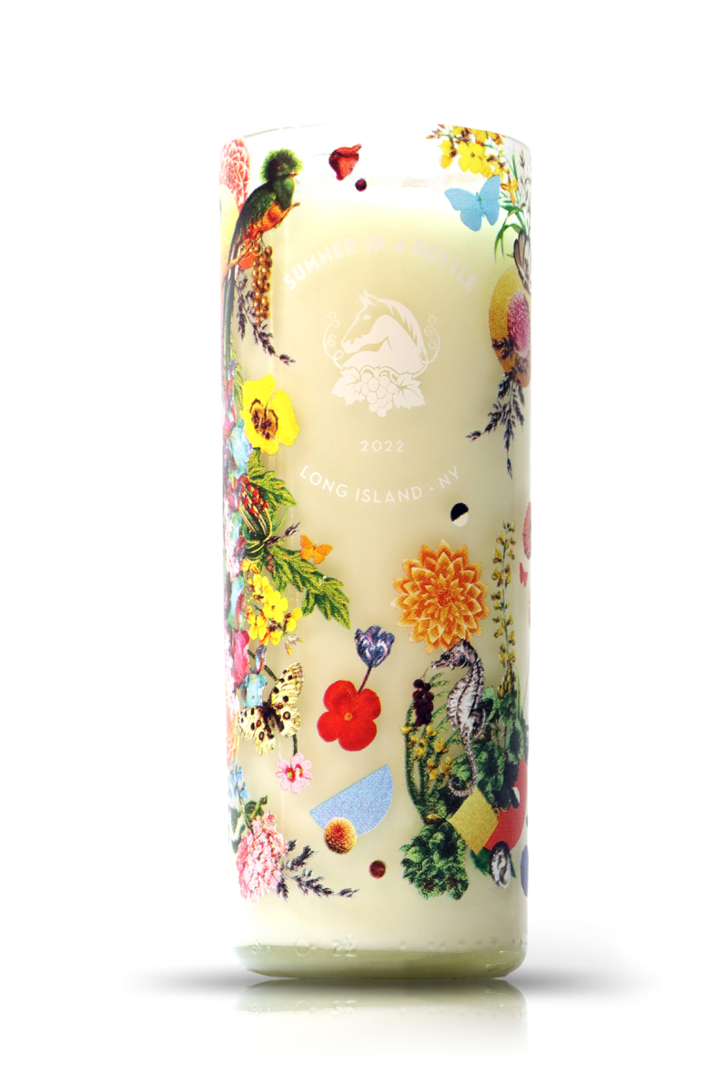 A Recycled Wolffer Estate Summer In A Bottle Wine Candle with a floral design.
