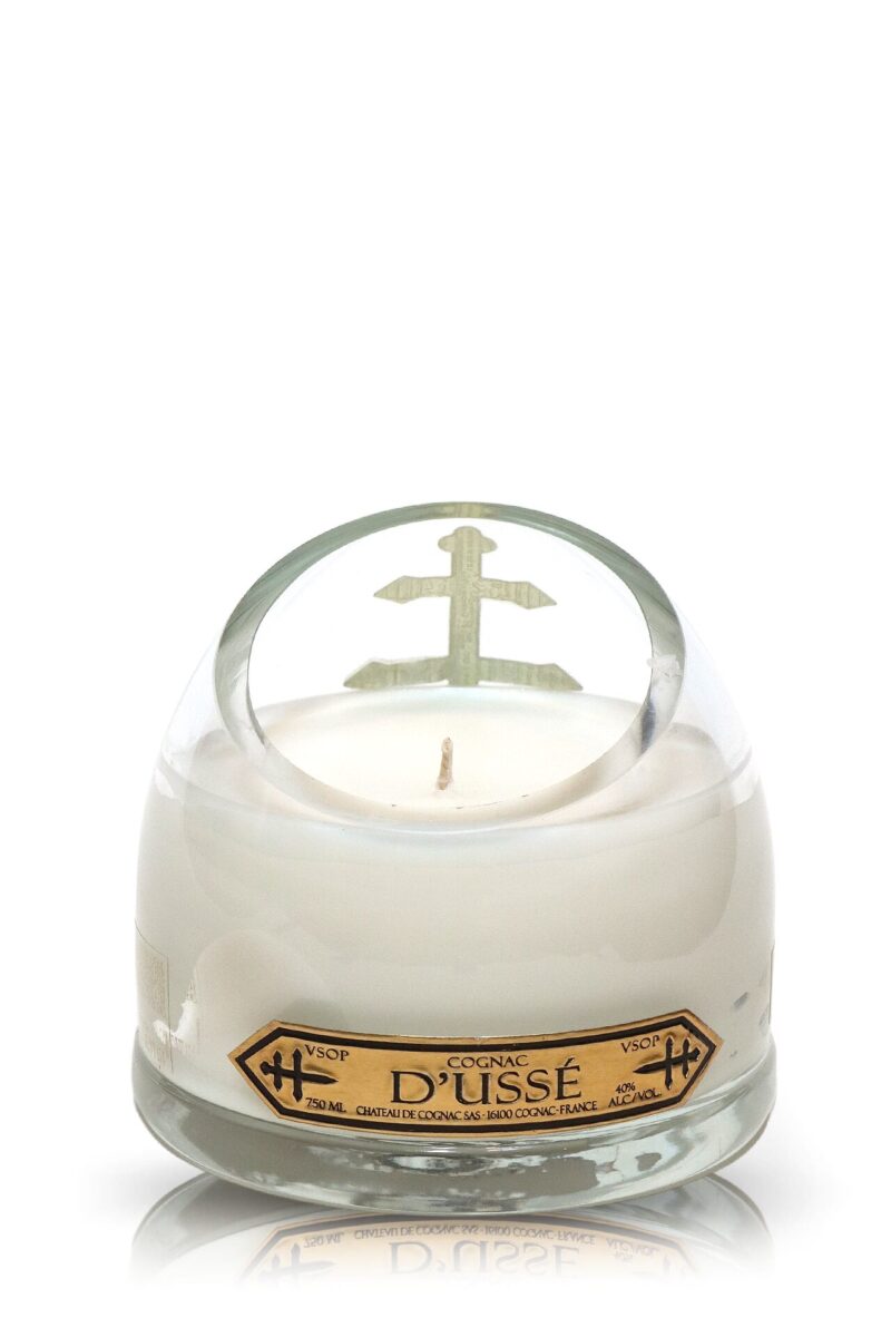 A Recycled D'usse VSOP Cognac Candle with a gold label.