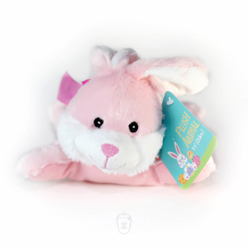 A stuffed Easter bunny that is pink and white