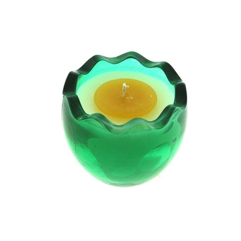A Green Glass Easter Egg w/ Yolk Wax candle holder with wite and yellow candle wax inside.
