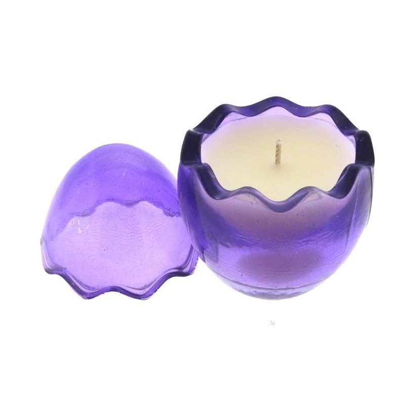 A Purple Glass Easter Egg container with a white candle inside.